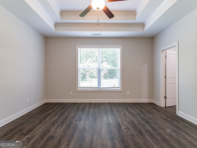 spare room featuring hardwood / wood-style floors, crown molding, a raised ceiling, and ceiling fan