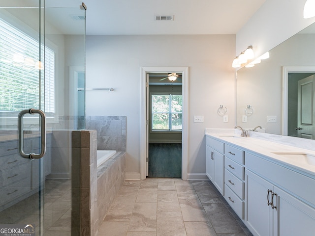 bathroom featuring separate shower and tub, dual bowl vanity, ceiling fan, and tile patterned floors