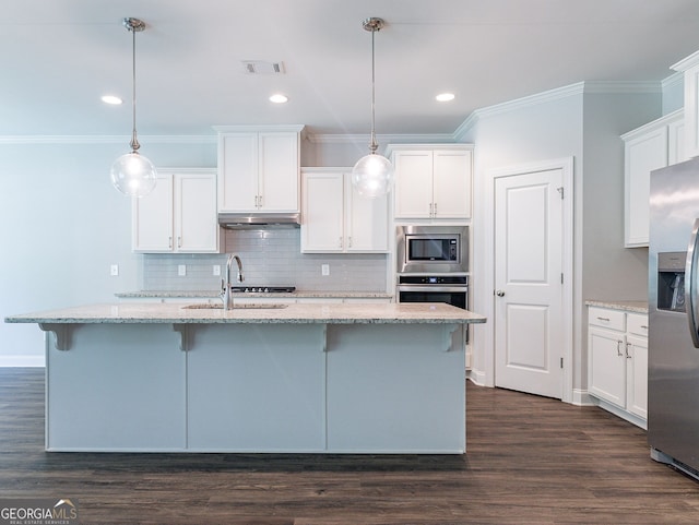 kitchen with pendant lighting, stainless steel appliances, white cabinets, sink, and dark wood-type flooring