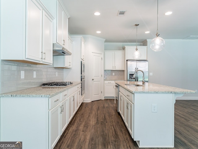 kitchen featuring decorative backsplash, dark wood-type flooring, pendant lighting, and white cabinets