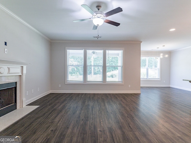 unfurnished living room featuring ornamental molding, dark hardwood / wood-style flooring, ceiling fan, and a high end fireplace