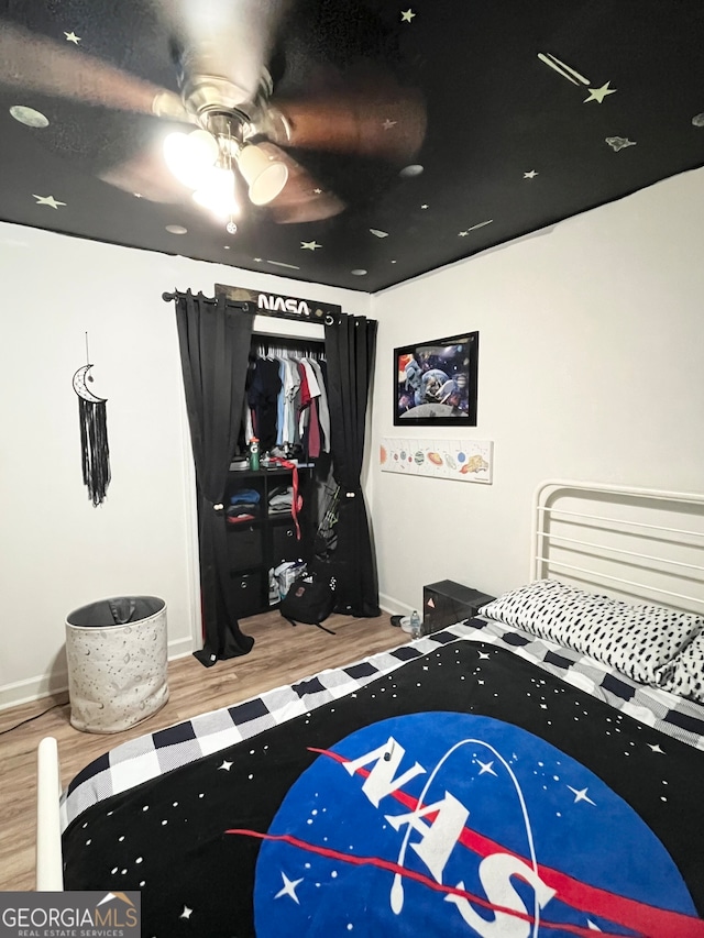 bedroom featuring ceiling fan and light hardwood / wood-style floors