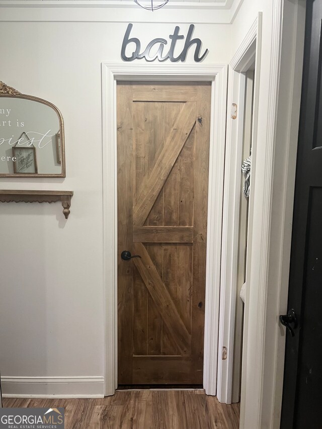 doorway to outside featuring wood-type flooring