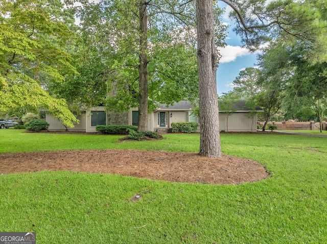 view of front of home with a front yard