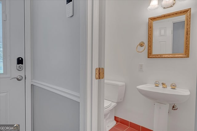 bathroom featuring tile patterned floors and toilet