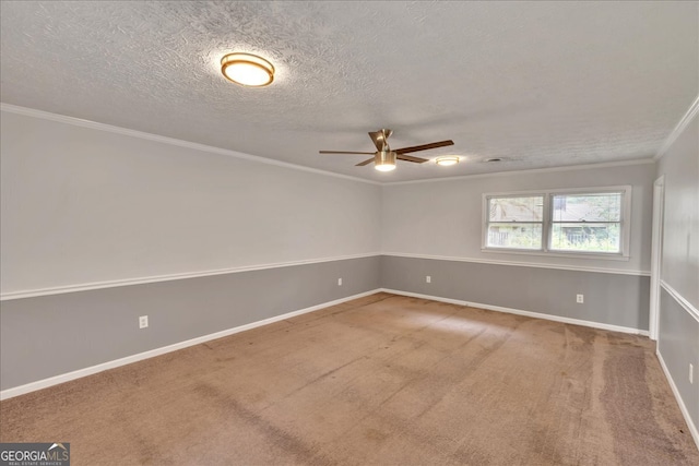 unfurnished room featuring ceiling fan, crown molding, carpet flooring, and a textured ceiling