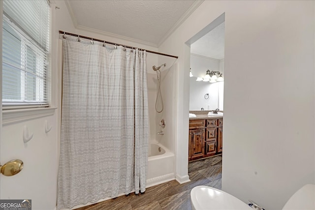 full bathroom with a textured ceiling, vanity, shower / tub combo, and toilet