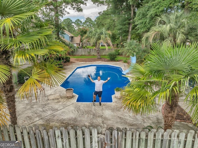 view of swimming pool featuring a patio area