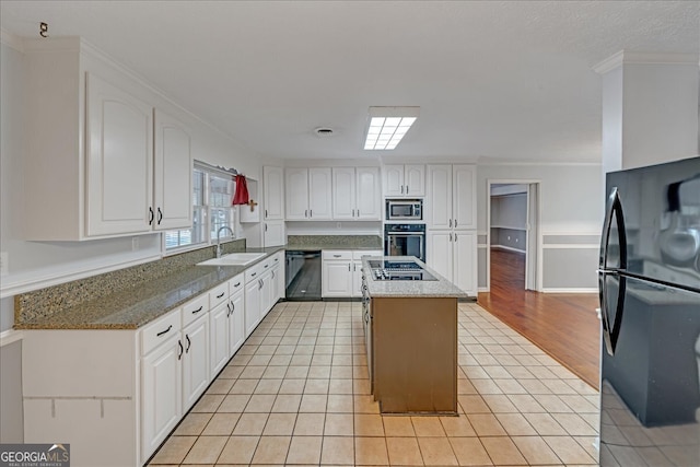 kitchen featuring white cabinetry, black appliances, light tile patterned flooring, a kitchen island, and sink