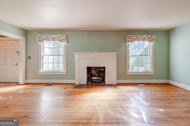 unfurnished living room featuring light hardwood / wood-style floors