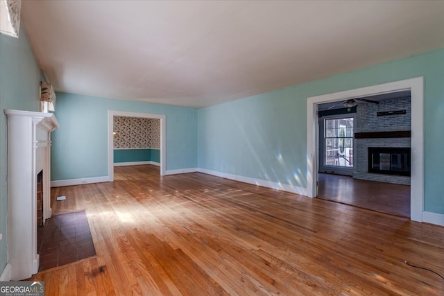 unfurnished living room with hardwood / wood-style floors