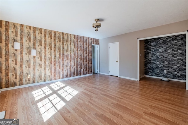 unfurnished room featuring light wood-type flooring