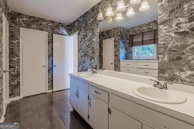 bathroom with vanity and parquet flooring