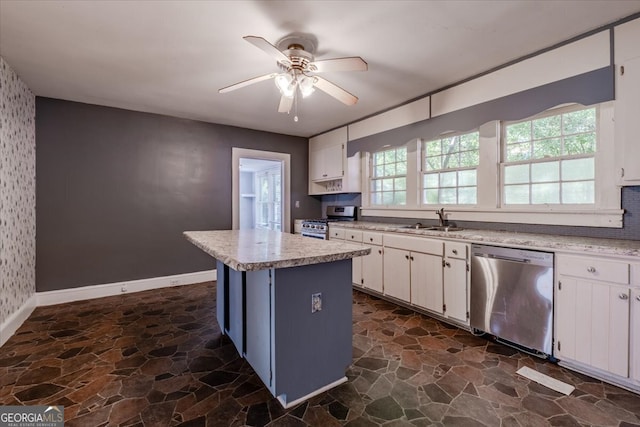 kitchen featuring a wealth of natural light, a kitchen island, white cabinets, and stainless steel appliances