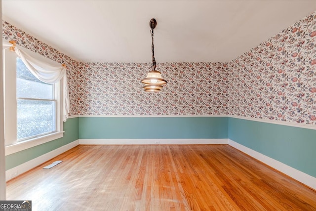 empty room with wood-type flooring