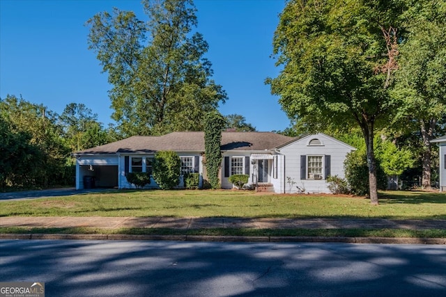 ranch-style home featuring a front yard