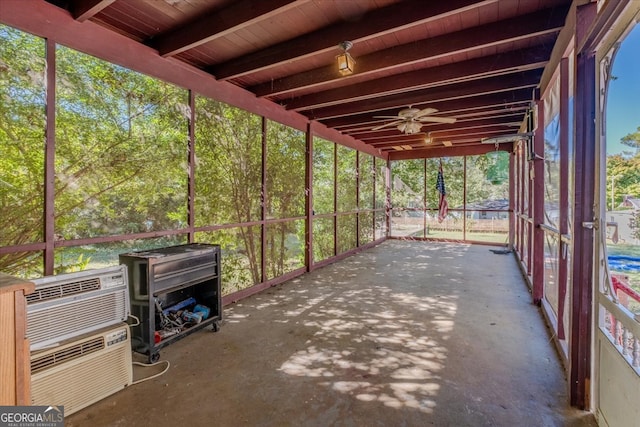 exterior space with beam ceiling and ceiling fan