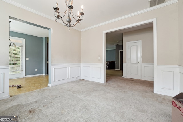 unfurnished room featuring crown molding, a chandelier, and light colored carpet