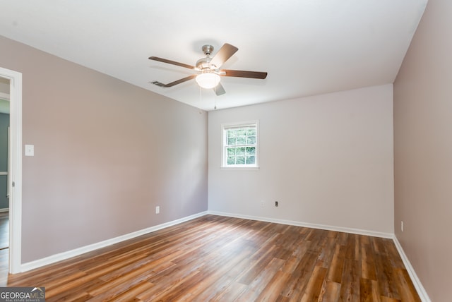 unfurnished room featuring hardwood / wood-style floors and ceiling fan