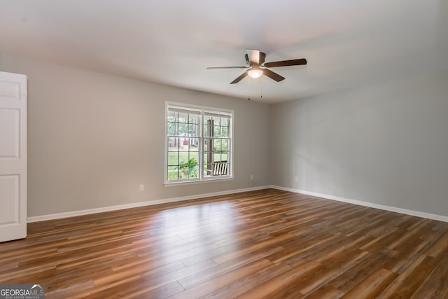 unfurnished room with hardwood / wood-style floors and ceiling fan