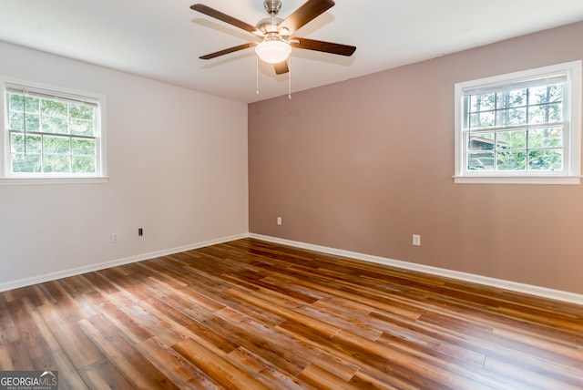 spare room featuring ceiling fan and wood-type flooring