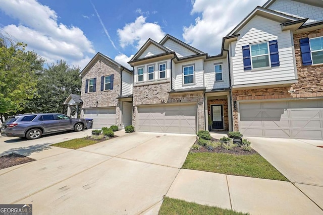 view of front of home with a garage, concrete driveway, and brick siding