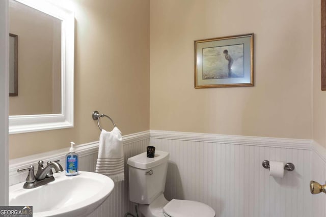 bathroom featuring sink and toilet