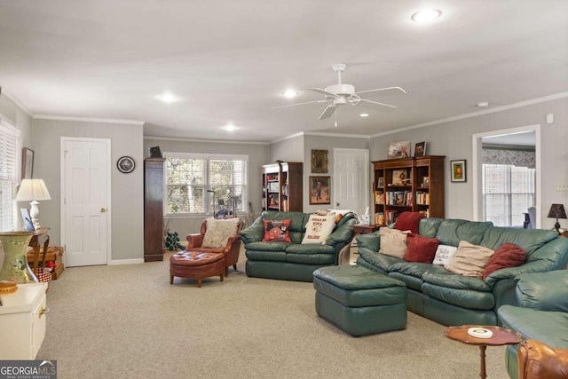 living room featuring light colored carpet, ornamental molding, and ceiling fan