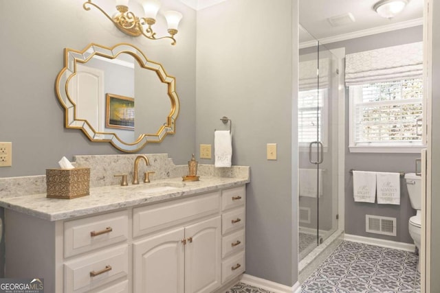 bathroom with toilet, tile patterned flooring, vanity, crown molding, and a shower with shower door