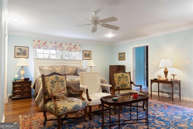 sitting room featuring ceiling fan, hardwood / wood-style floors, and ornamental molding