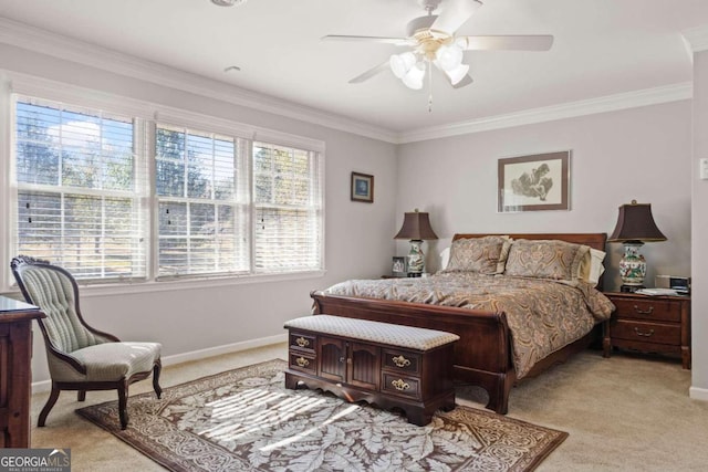 bedroom featuring ceiling fan, crown molding, and light colored carpet