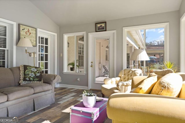 living room with lofted ceiling and dark hardwood / wood-style flooring