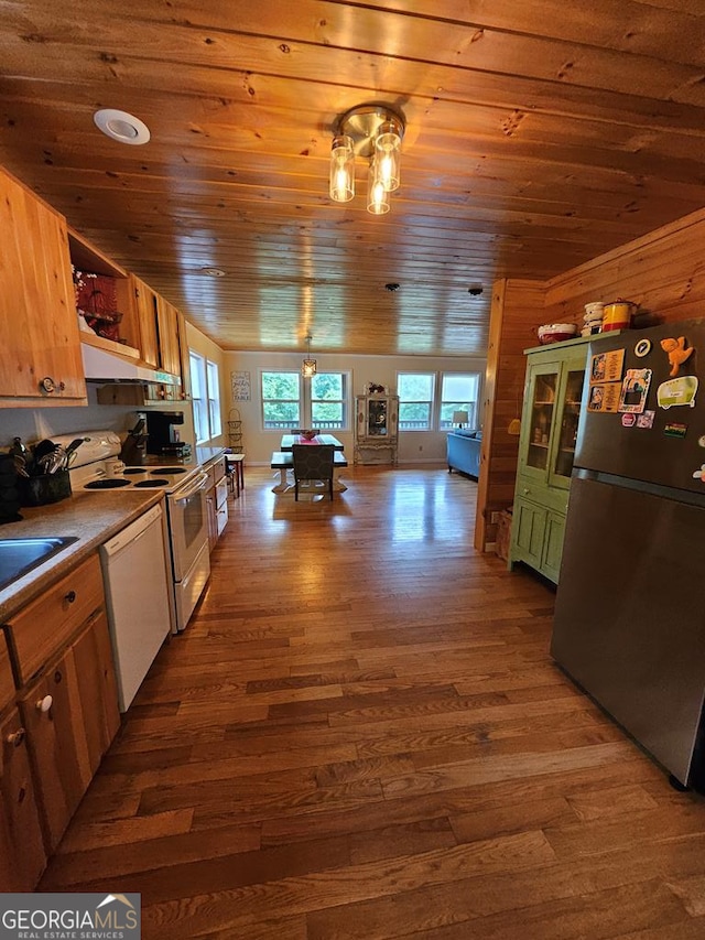 kitchen featuring light wood-type flooring, sink, white appliances, and wooden ceiling