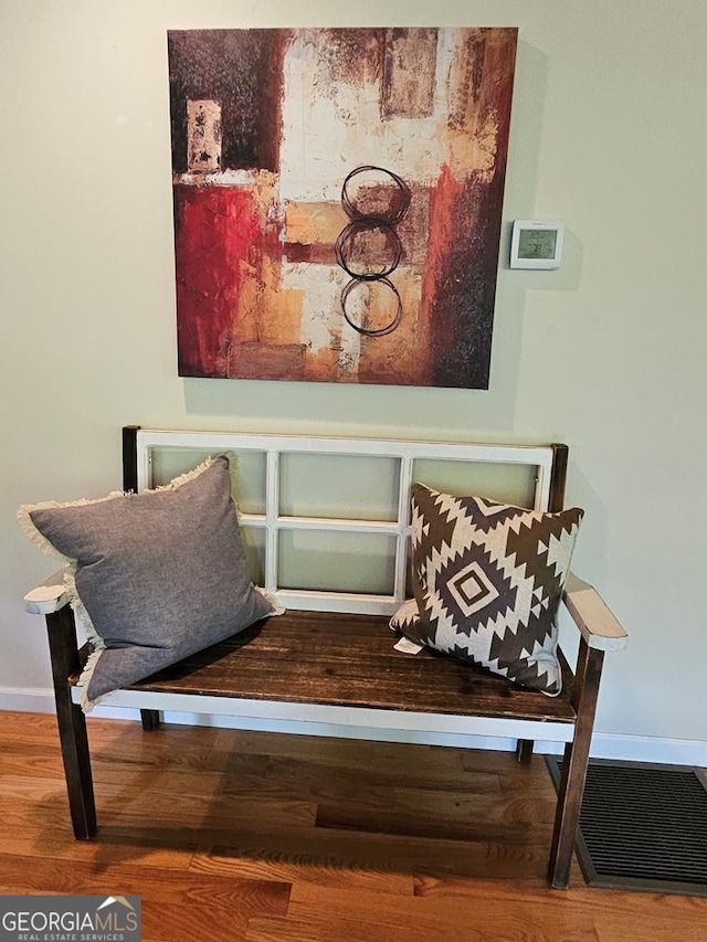 sitting room with hardwood / wood-style floors