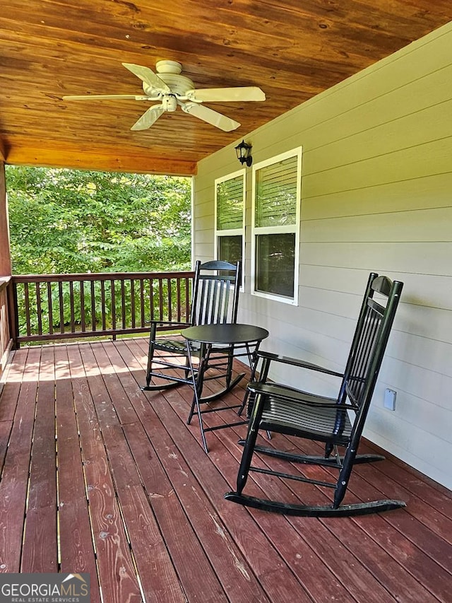 wooden deck with ceiling fan and a porch