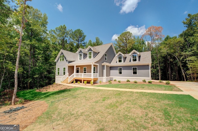 cape cod-style house featuring a front lawn