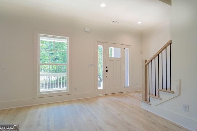 entrance foyer with light wood-type flooring and plenty of natural light