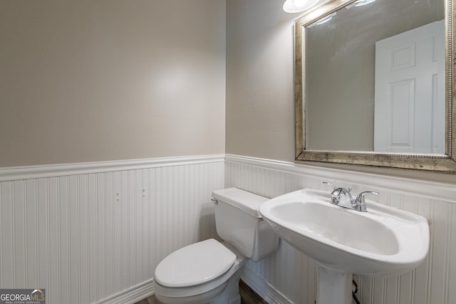 bathroom featuring sink and toilet