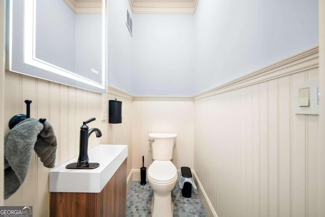 bathroom featuring toilet and vanity