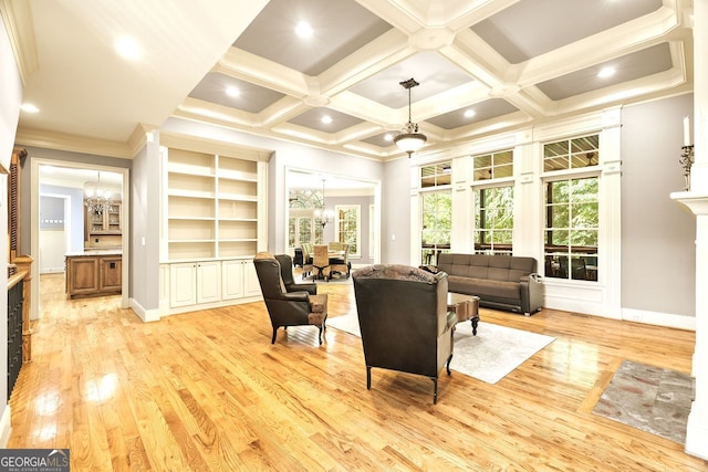 sitting room with beamed ceiling, a chandelier, light hardwood / wood-style flooring, and coffered ceiling