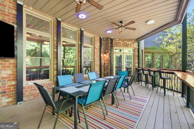 wooden terrace featuring ceiling fan