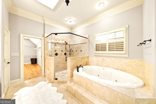 bathroom with wood-type flooring, a skylight, separate shower and tub, and crown molding