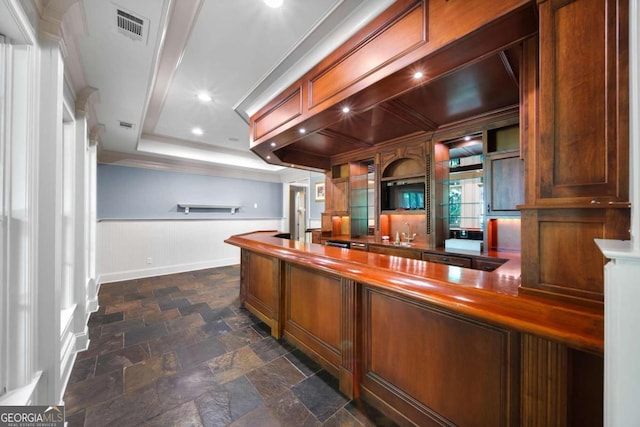 interior space featuring sink and ornamental molding