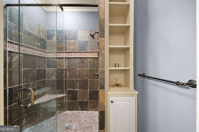 bathroom featuring a shower with shower door