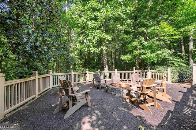 view of patio with a fire pit