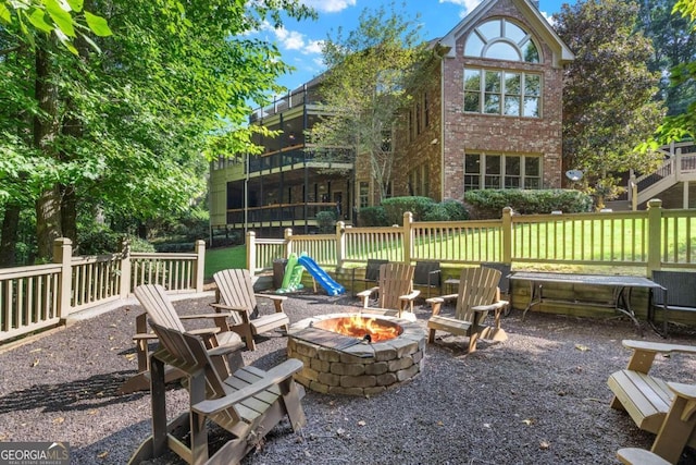 view of patio / terrace with an outdoor fire pit