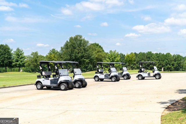 view of parking / parking lot with a yard