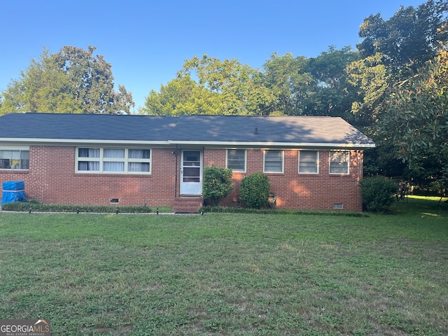 single story home featuring a front yard