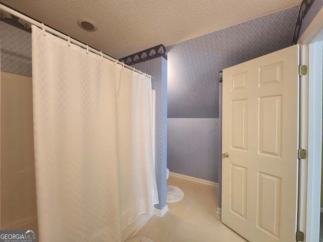 bathroom with a textured ceiling