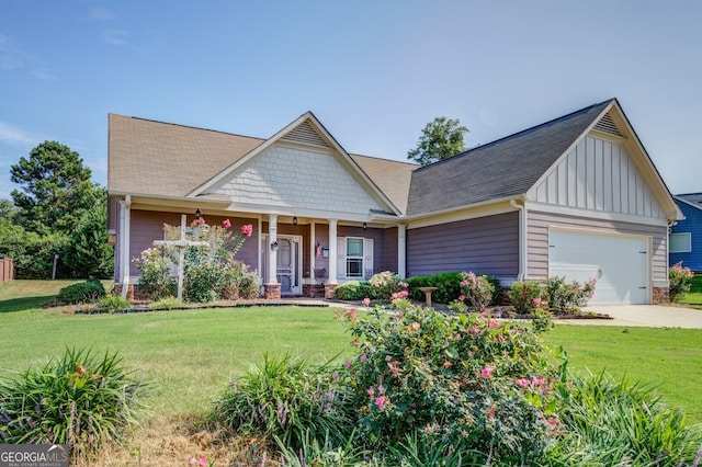 craftsman-style house with a front yard, a garage, and a porch